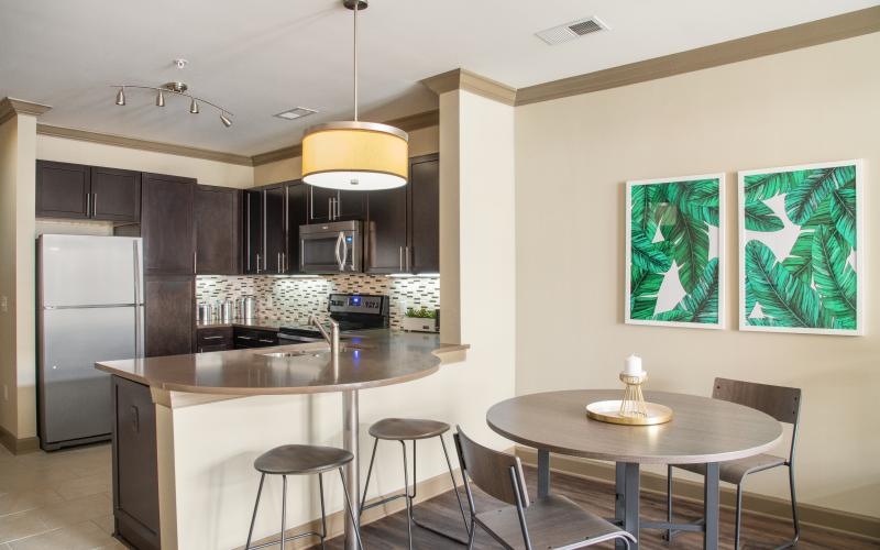 a kitchen with a table and chairs