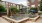 a fountain in a courtyard between buildings