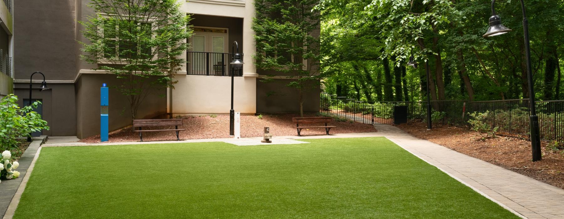 a large green lawn in front of a building