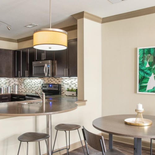 Relax and unwind in stylish living spaces a kitchen with a table and chairs