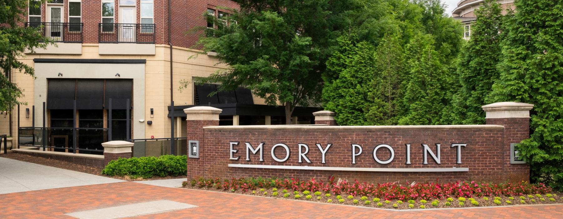 a brick building with a sign on it